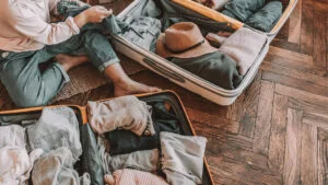 How to Pack a Suitcase Without Wrinkles - roll clothes - carry-on